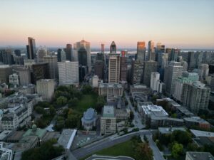 ID: 34418263 | Photographer: Narno Beats | Photographer URL: https://www.pexels.com/@narno-beats-2153147039 | Alt: A panoramic aerial view of Montreal's skyline at sunset with cityscape and greenery | Page URL: https://www.pexels.com/photo/aerial-view-of-montreal-at-sunset-34418263/ | License: Free, no attribution required|Aerial view of Montreal at sunset