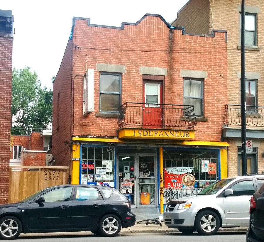 One Dollar Dépanneur corner store with yellow awning in Montreal