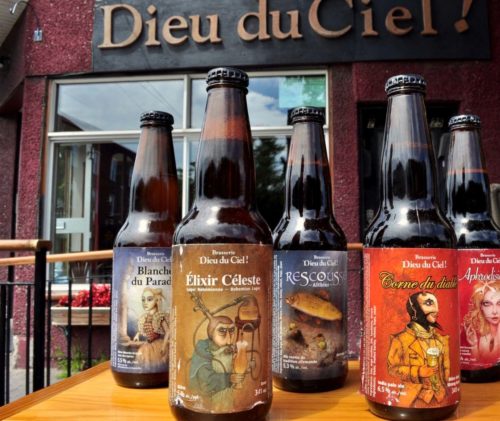 Lineup of Dieu du Ciel beer bottles in front of the Mile End brewpub on Laurier Avenue