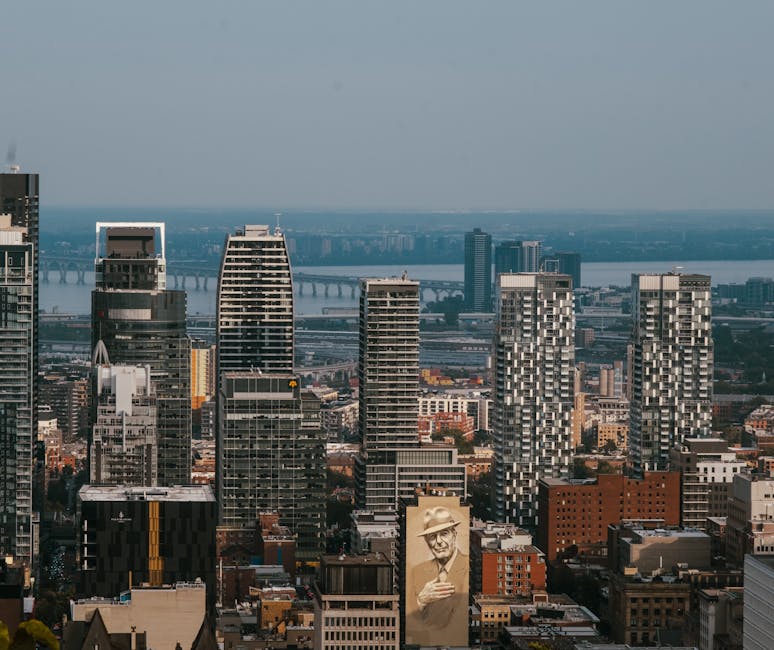Aerial view of downtown Montreal skyline with the Jacques Cartier Bridge in the foreground
