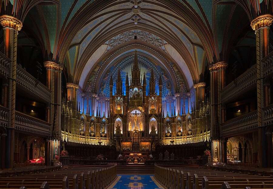 Notre-Dame Basilica interior with the famous blue and gold altar lit up