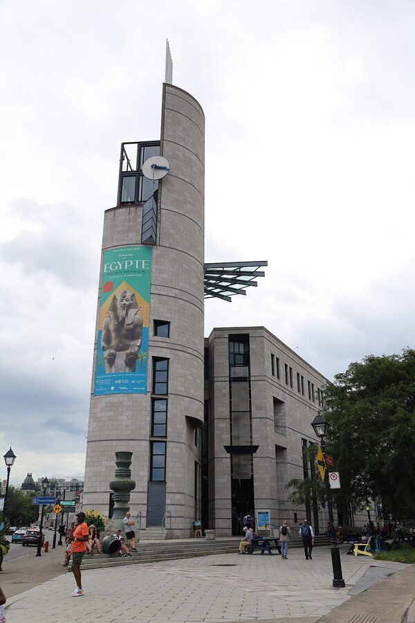 Pointe-à-Callière Museum exterior tower with poster, Old Montreal